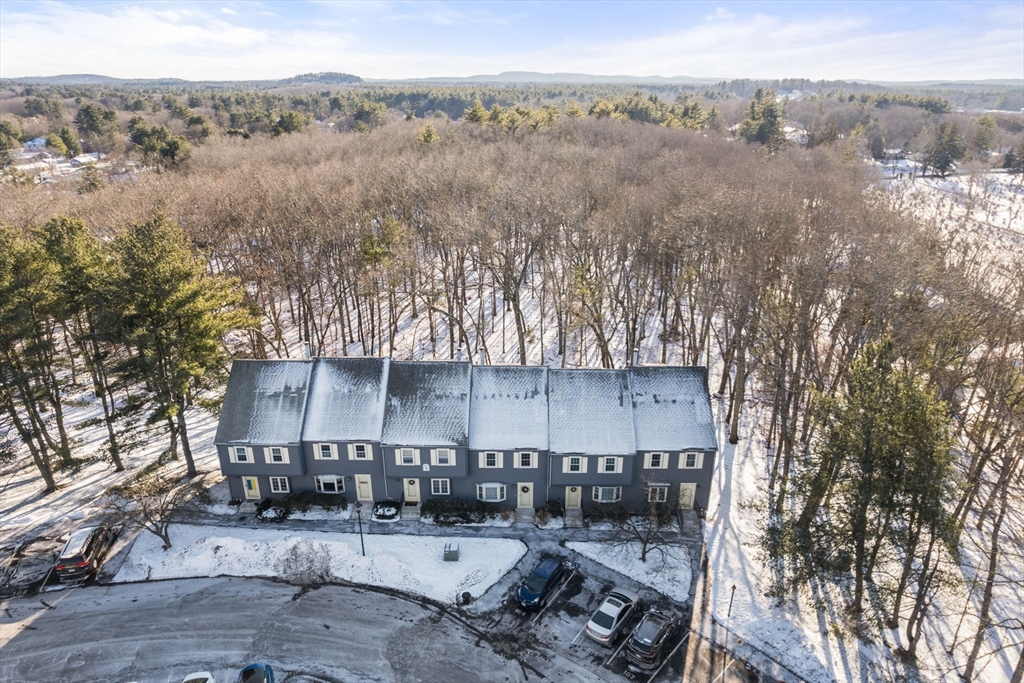 9 Oak Ridge Drive, Unit 6 Maynard, MA 01754 - Photo 32 of 39 an aerial view of a house with a yard and mountain view