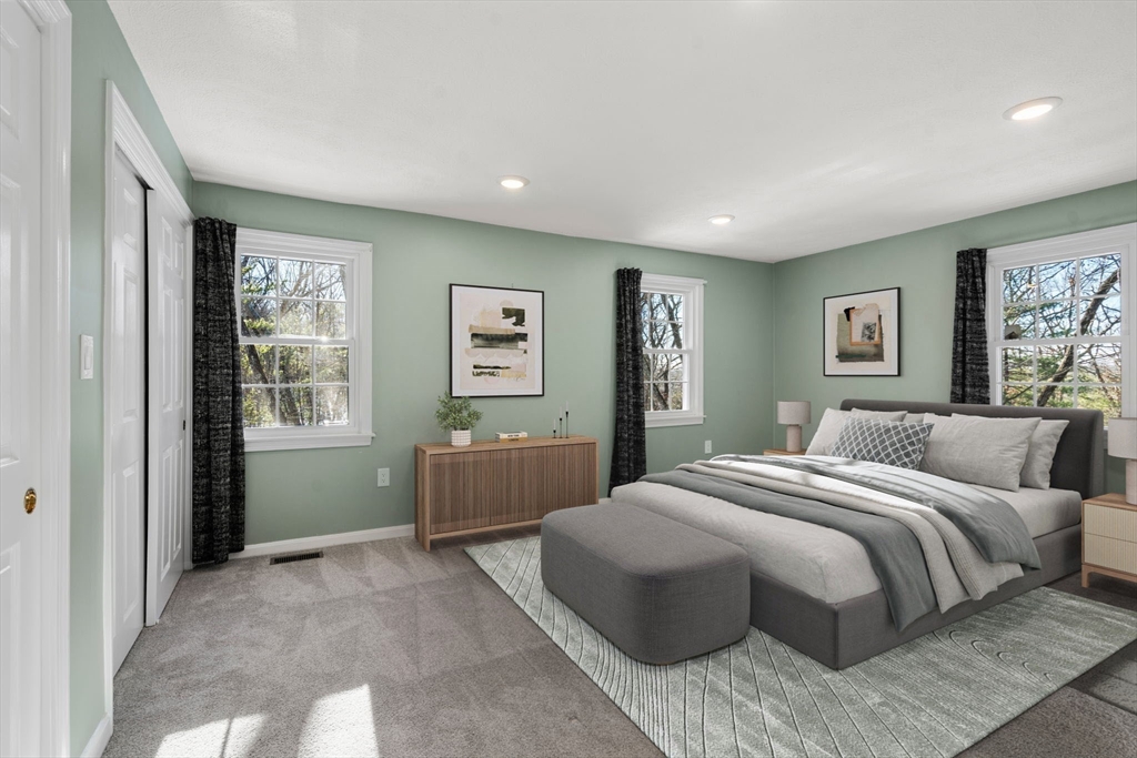 9 Oak Ridge Drive, Unit 6 Maynard, MA 01754 - Photo 6 of 39 a bedroom with a large bed and a window