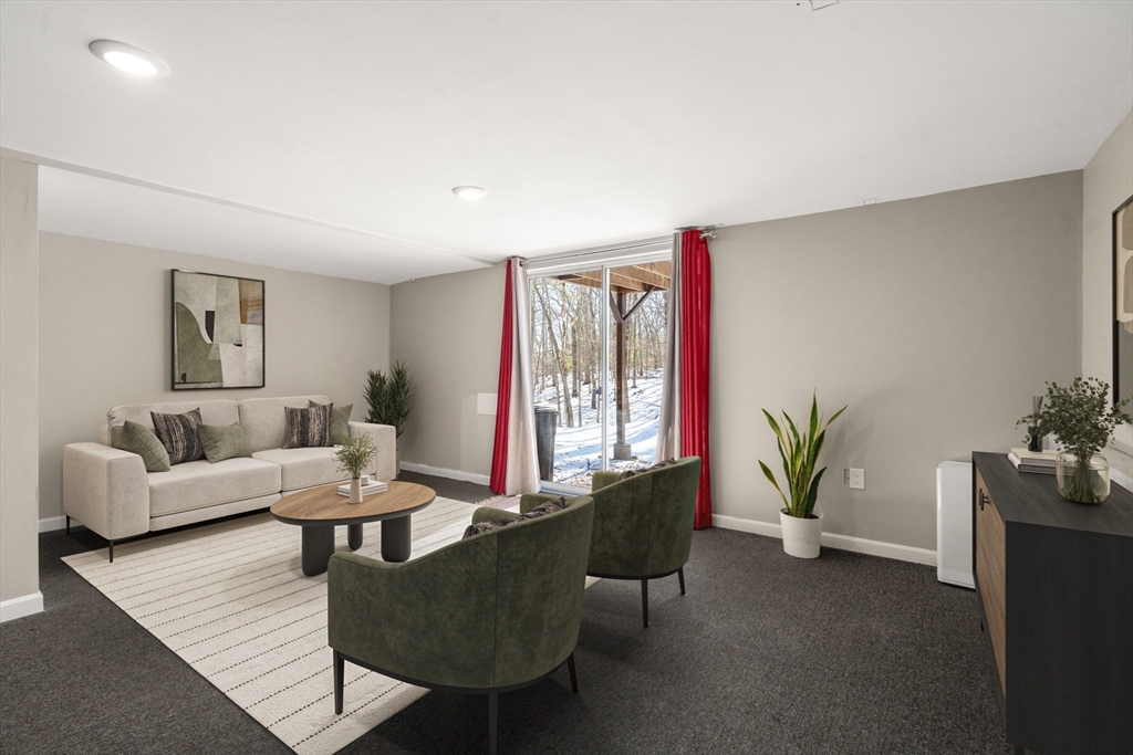 9 Oak Ridge Drive, Unit 6 Maynard, MA 01754 - Photo 7 of 39 a living room with furniture and wooden floor