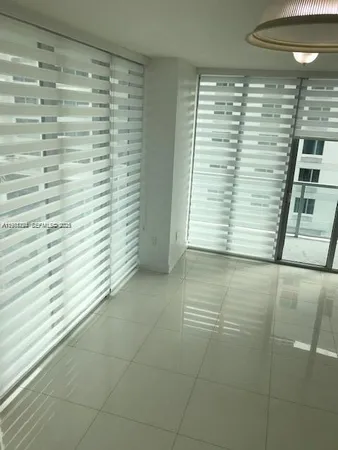 a view of a room that has a window