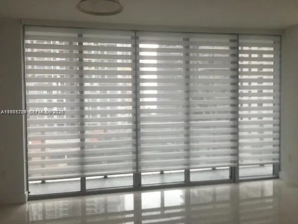 a view of empty room with windows