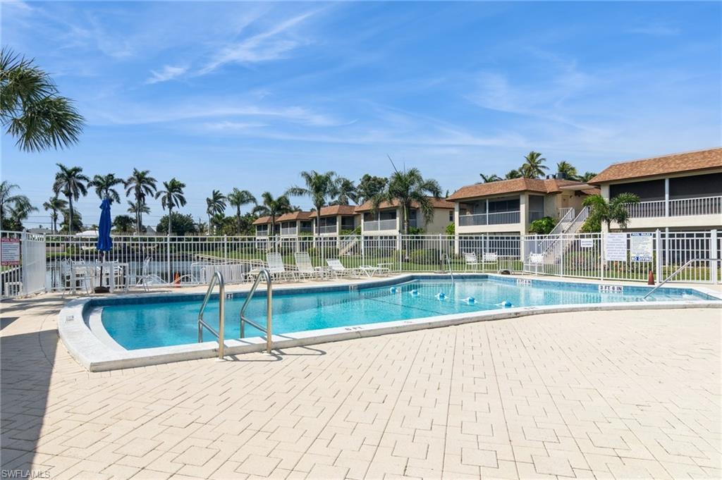 1155 Sandpiper Street, Unit B3 Naples, FL 34102 - Photo 21 of 21 Community pool featuring a patio