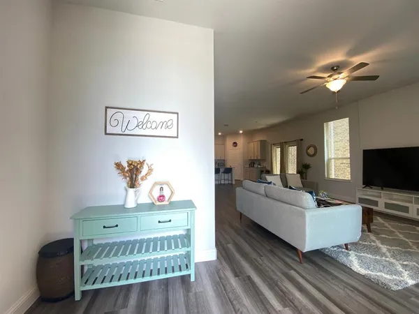 a living room with furniture and a flat screen tv
