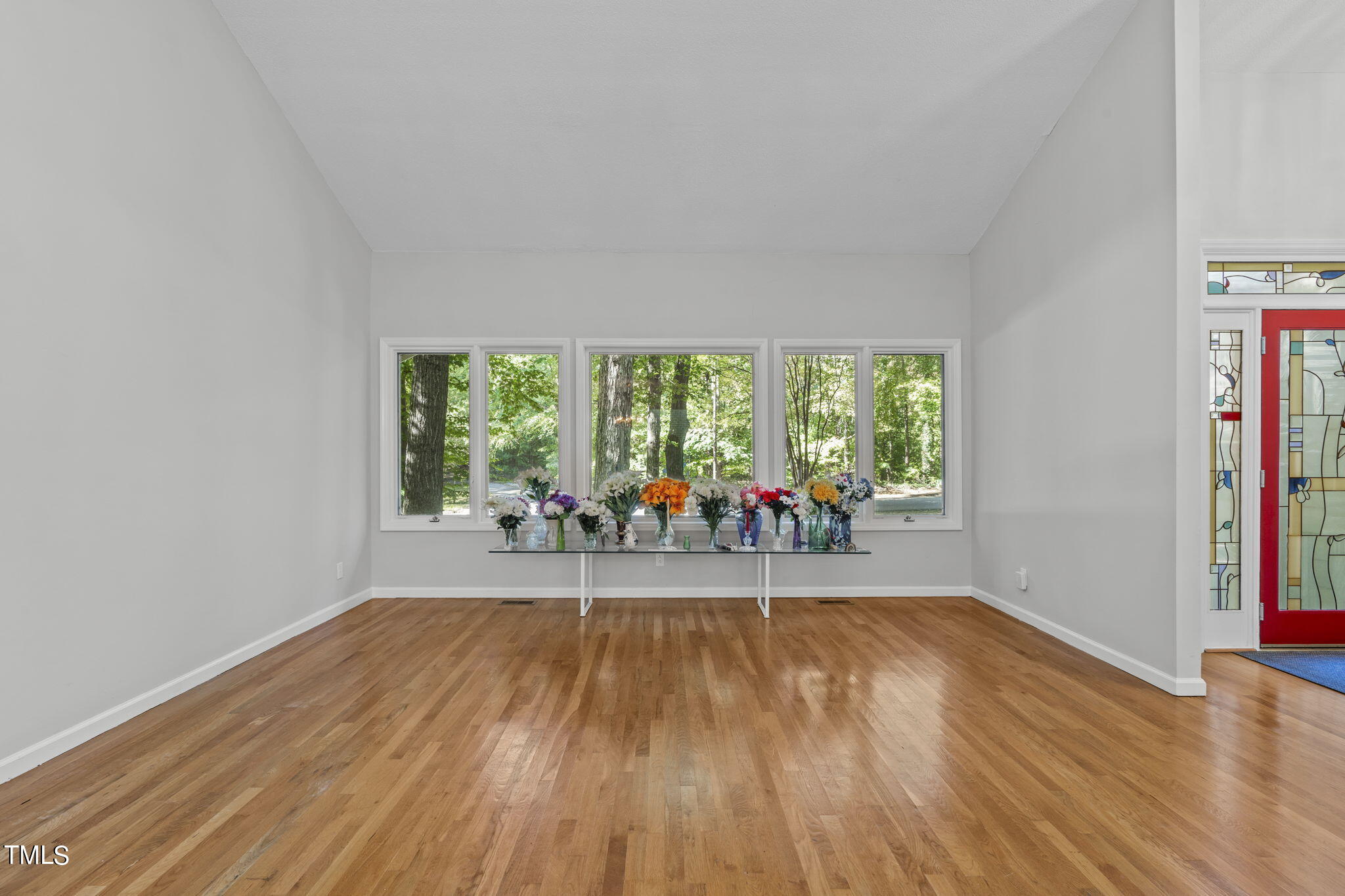 404 King George Loop Cary, NC 27511 - Photo 12 of 60 a view of empty room with wooden floor and fan
