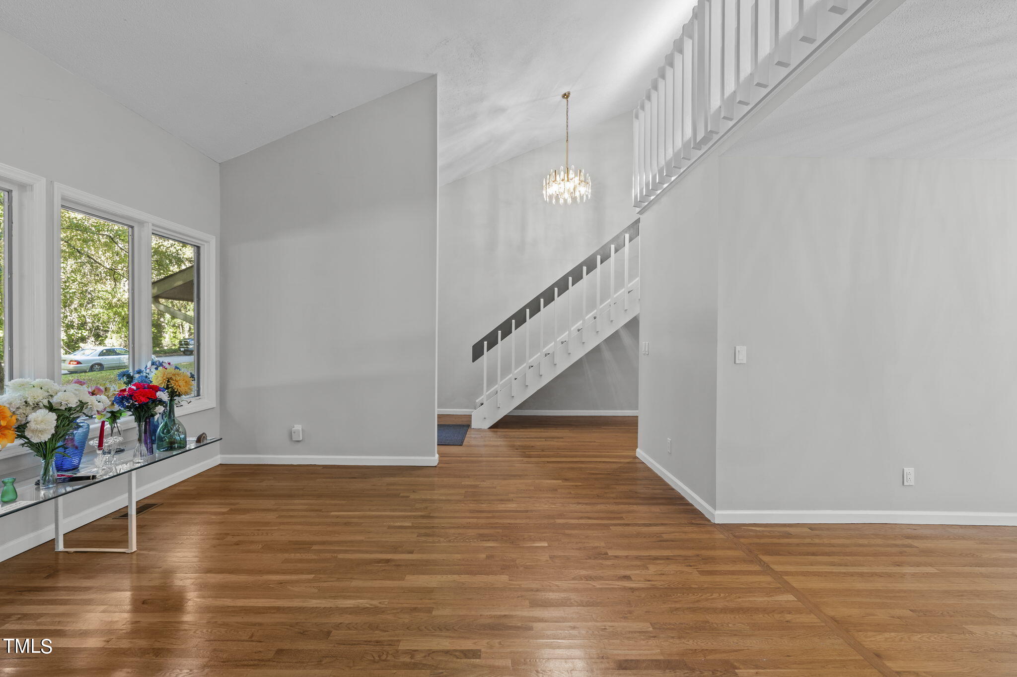 404 King George Loop Cary, NC 27511 - Photo 14 of 60 a view of entryway and hall with wooden floor