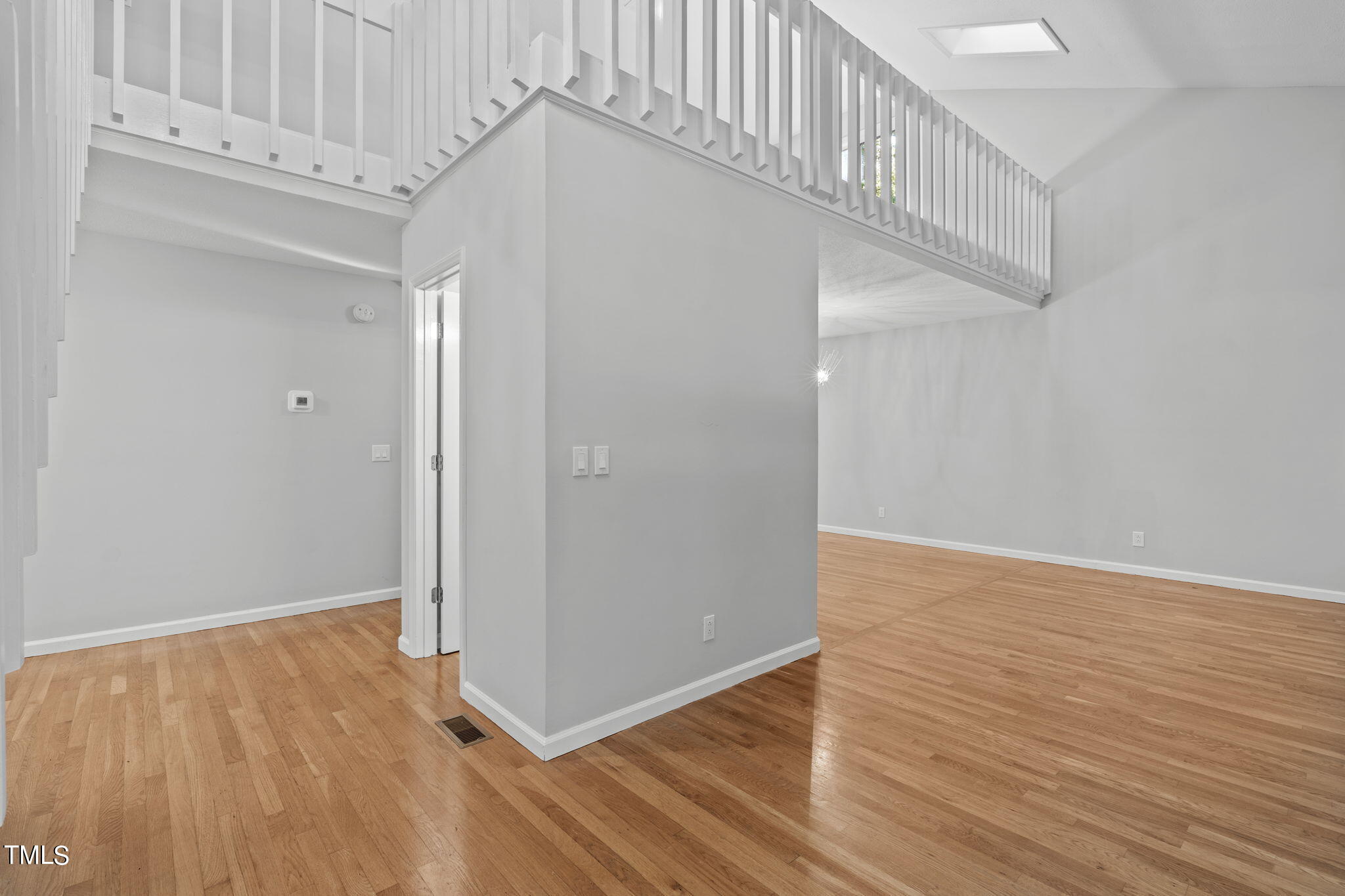 404 King George Loop Cary, NC 27511 - Photo 17 of 60 a view of an entryway with wooden floor