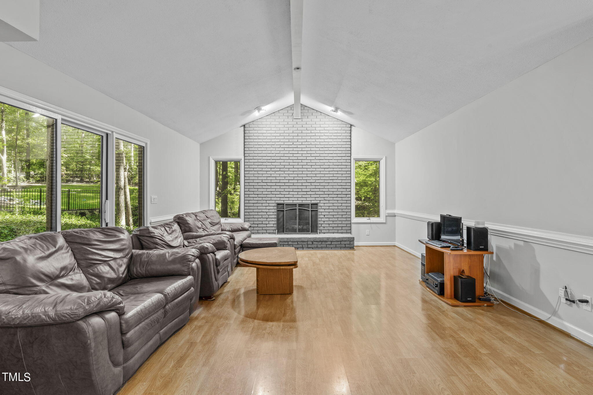404 King George Loop Cary, NC 27511 - Photo 27 of 60 a living room with furniture and a fireplace