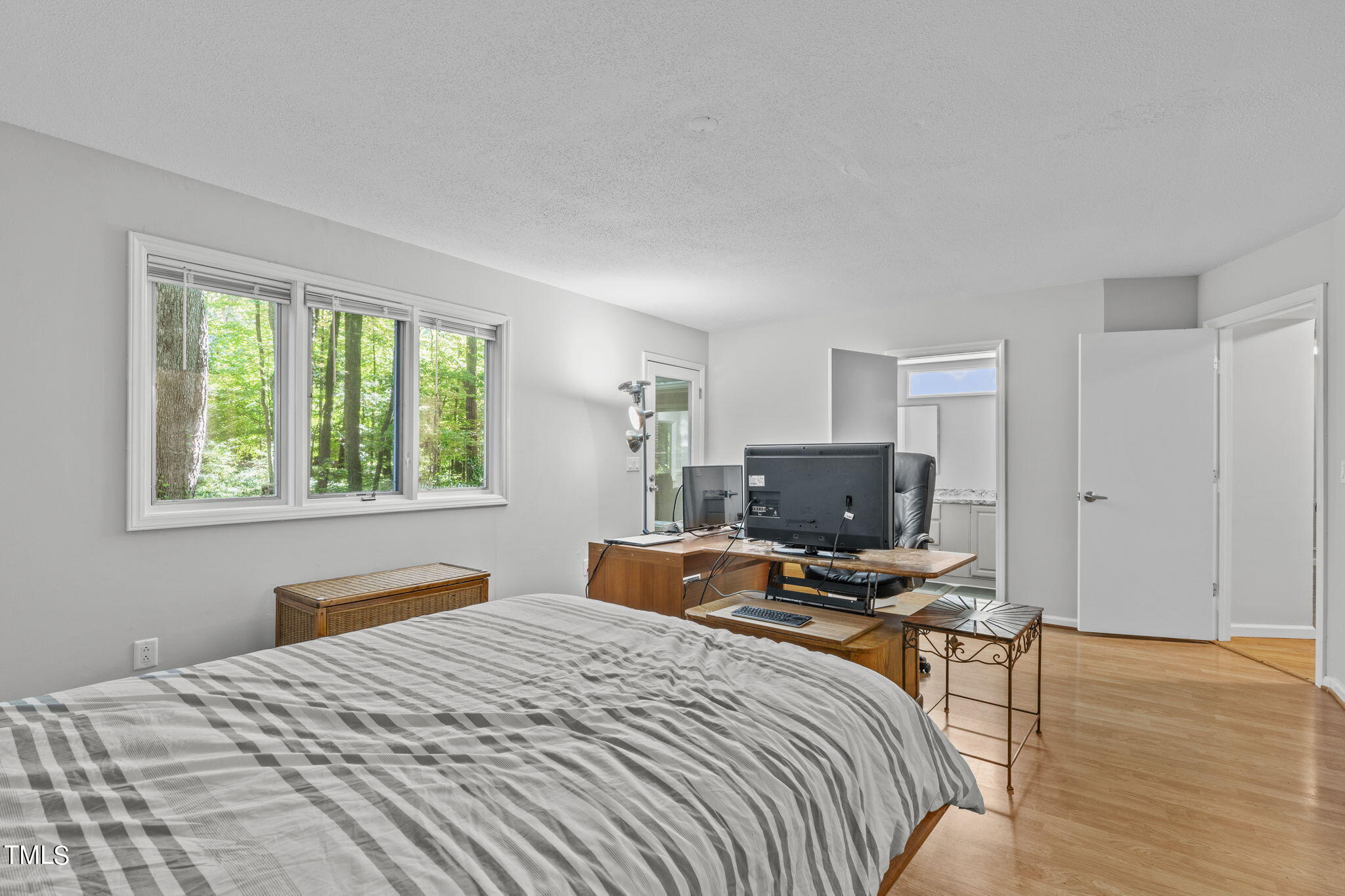 404 King George Loop Cary, NC 27511 - Photo 32 of 60 a bedroom with a bed and large windows