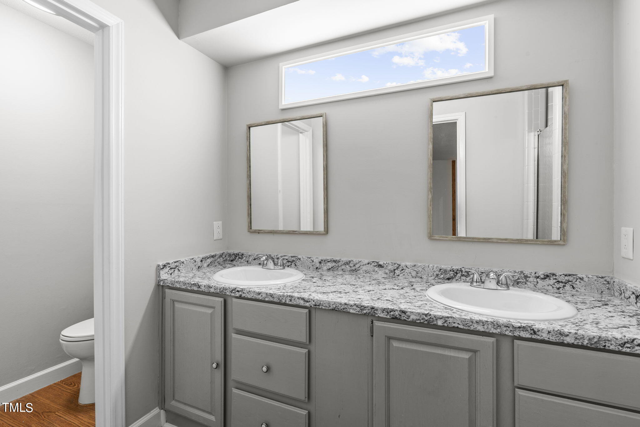 404 King George Loop Cary, NC 27511 - Photo 35 of 60 a bathroom with a granite countertop sink and a mirror