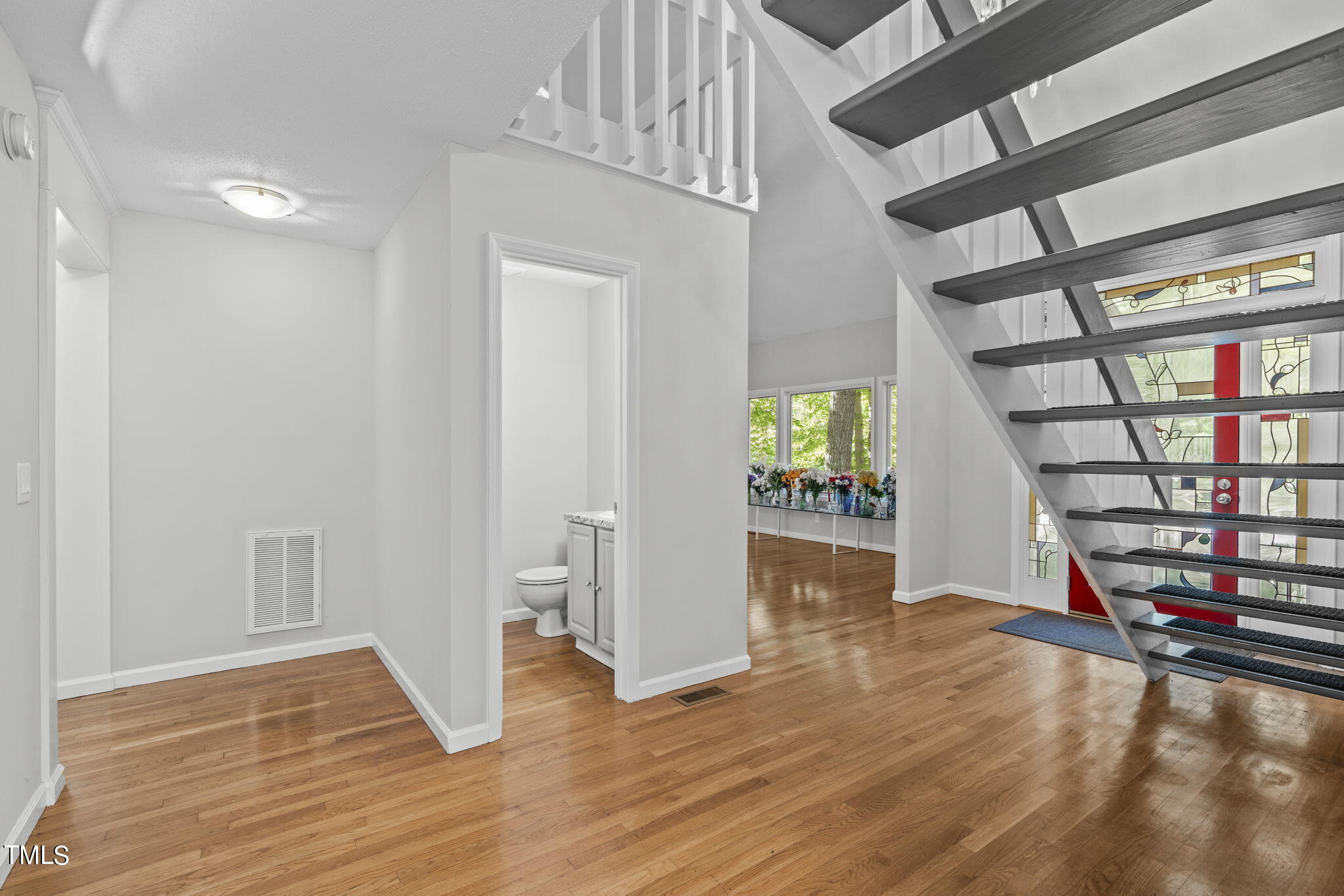 404 King George Loop Cary, NC 27511 - Photo 36 of 60 wooden floor in an empty room with a window