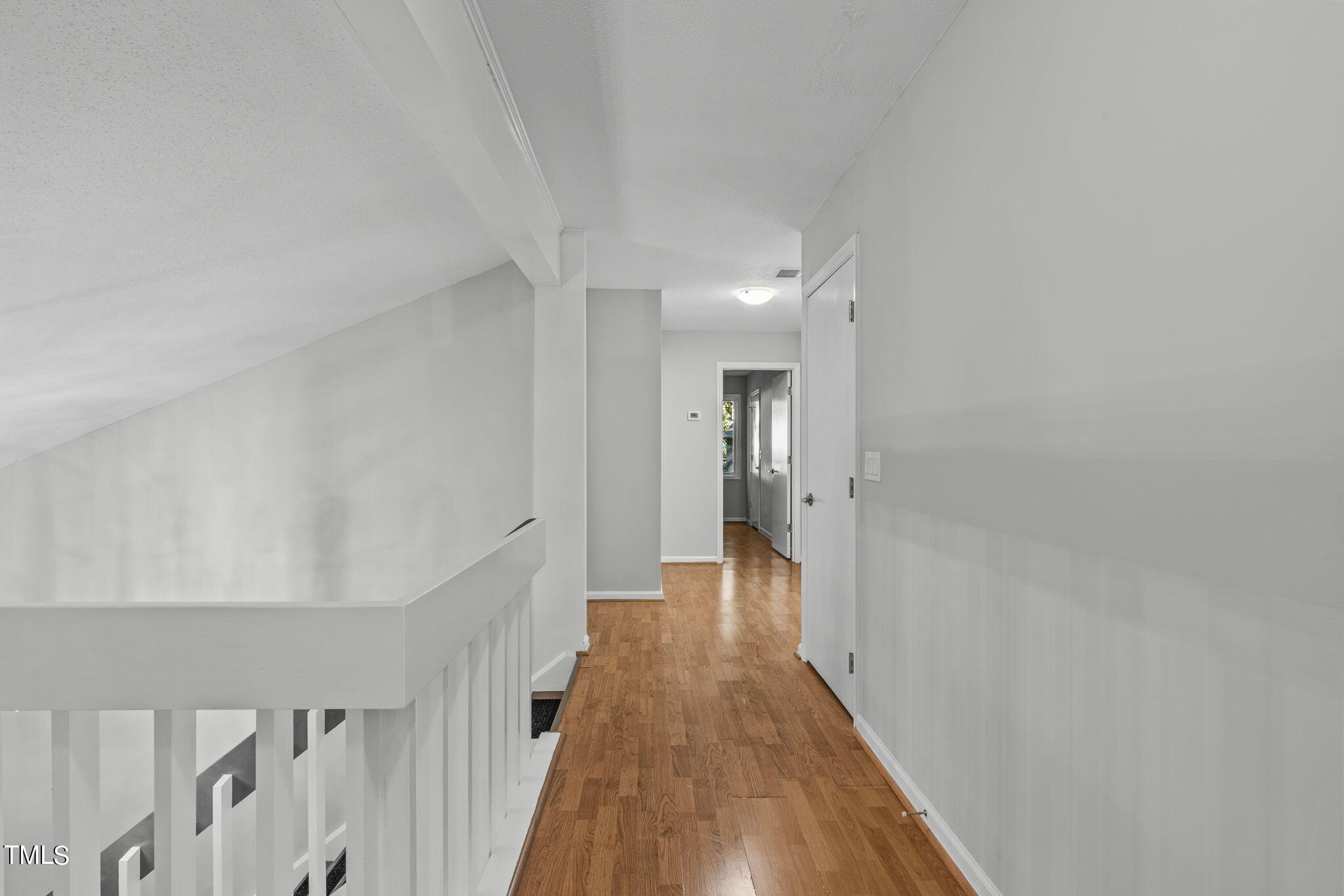 404 King George Loop Cary, NC 27511 - Photo 38 of 60 a view of a hallway with wooden floor