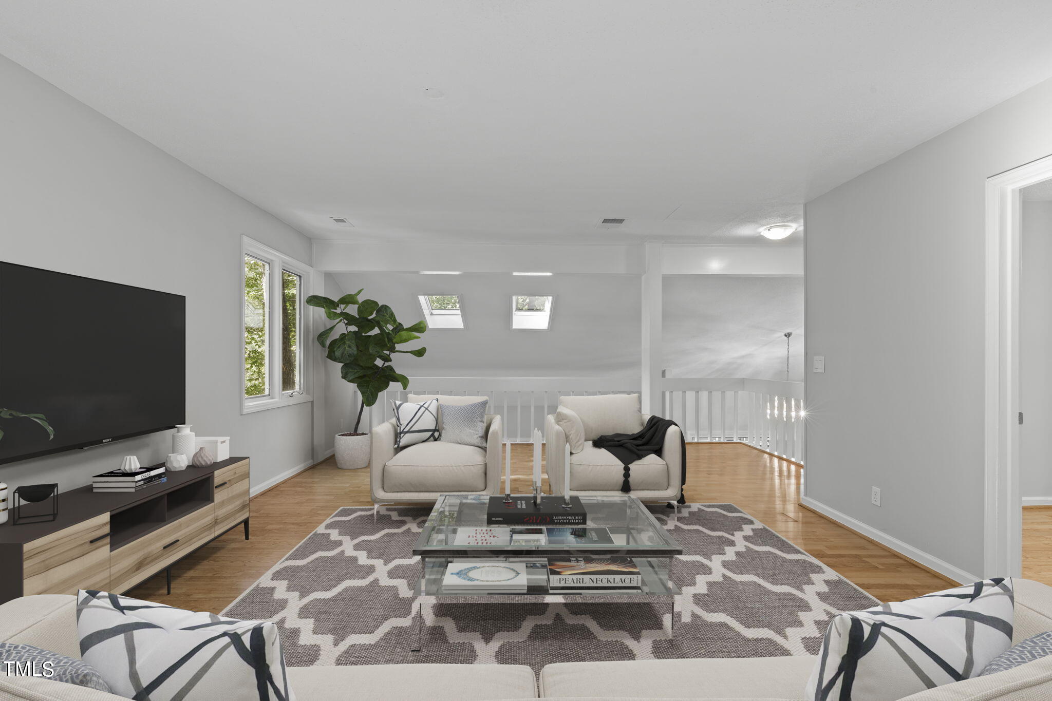 404 King George Loop Cary, NC 27511 - Photo 40 of 60 a living room with furniture and a flat screen tv