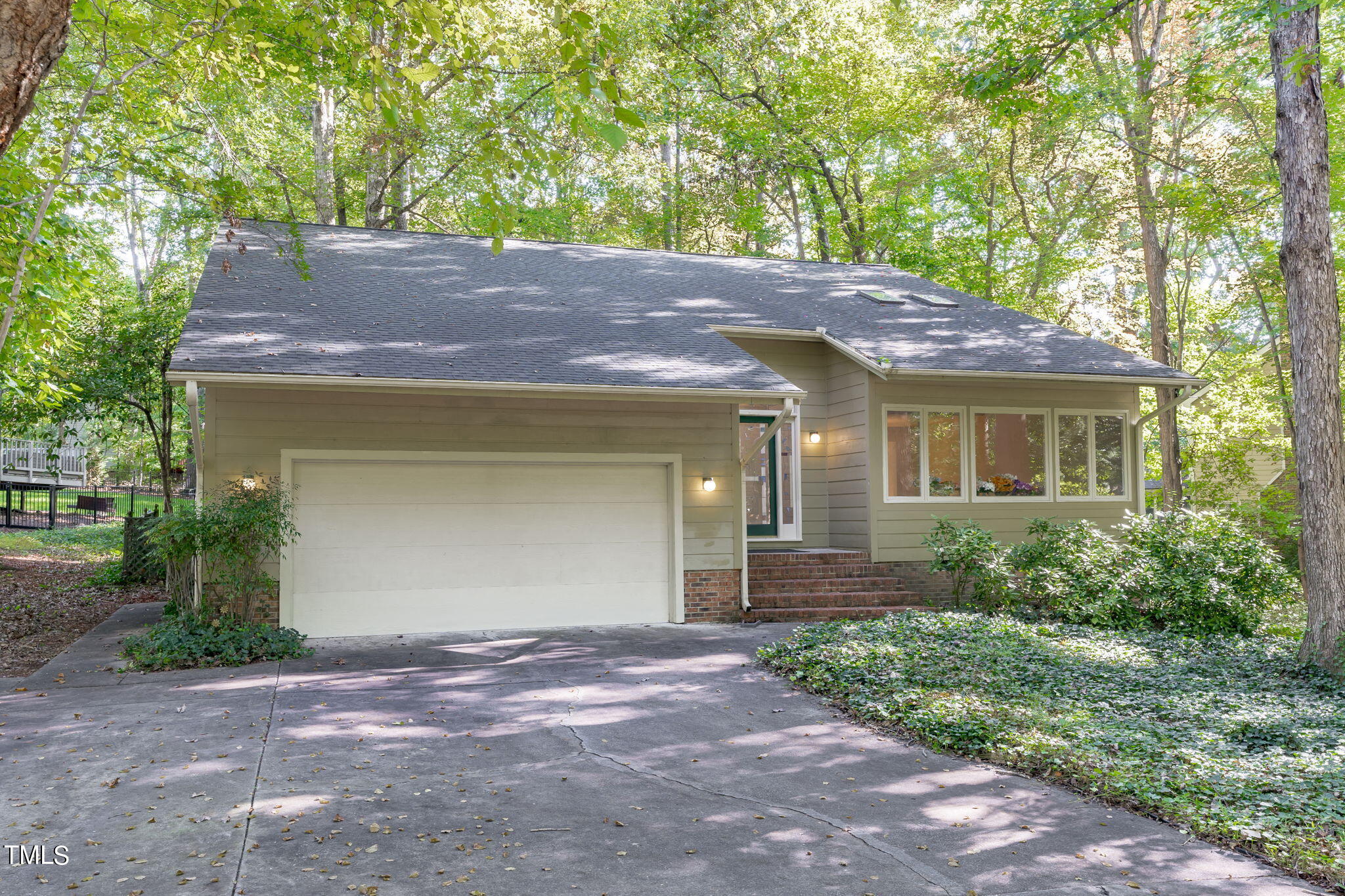 404 King George Loop Cary, NC 27511 - Photo 4 of 60 a front view of a house with garden