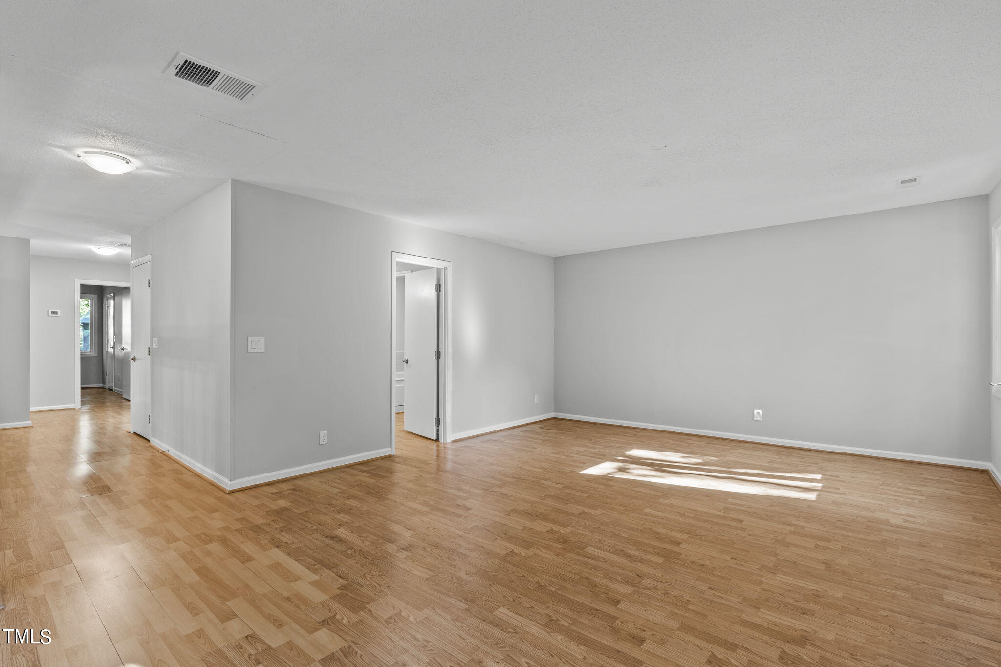 404 King George Loop Cary, NC 27511 - Photo 42 of 60 a view of an empty room with wooden floor