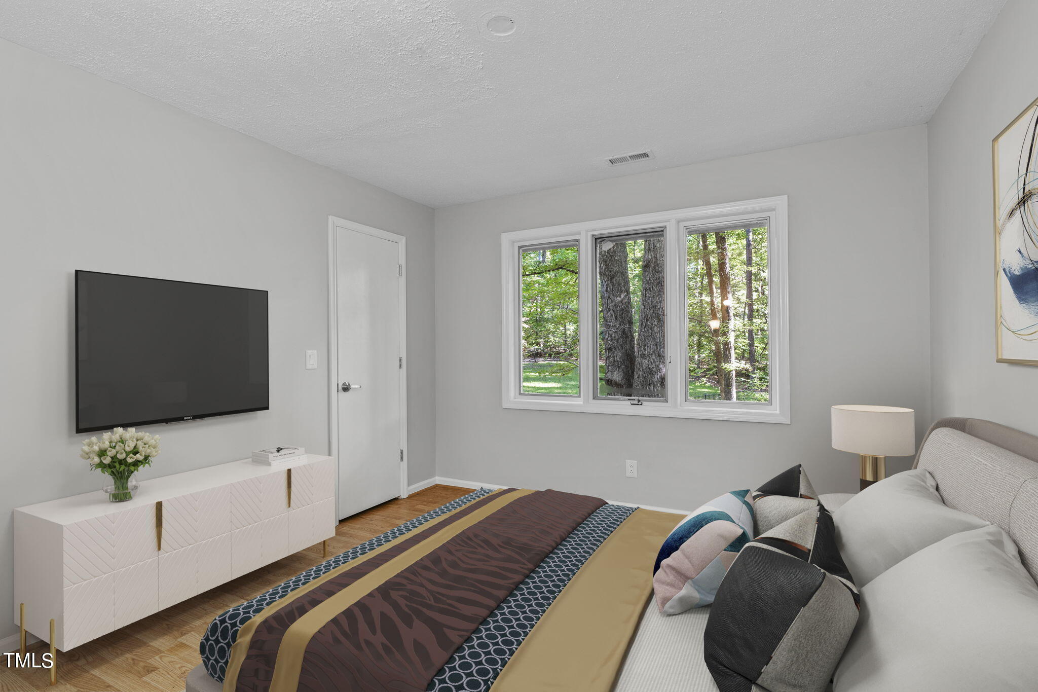 404 King George Loop Cary, NC 27511 - Photo 46 of 60 a bedroom with a bed and a flat screen tv