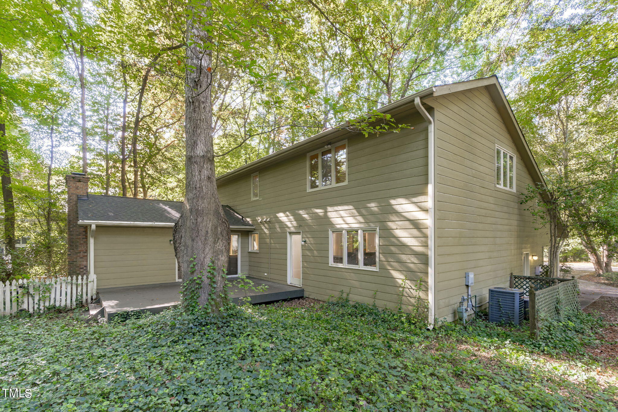 404 King George Loop Cary, NC 27511 - Photo 58 of 60 a front view of a house with garden