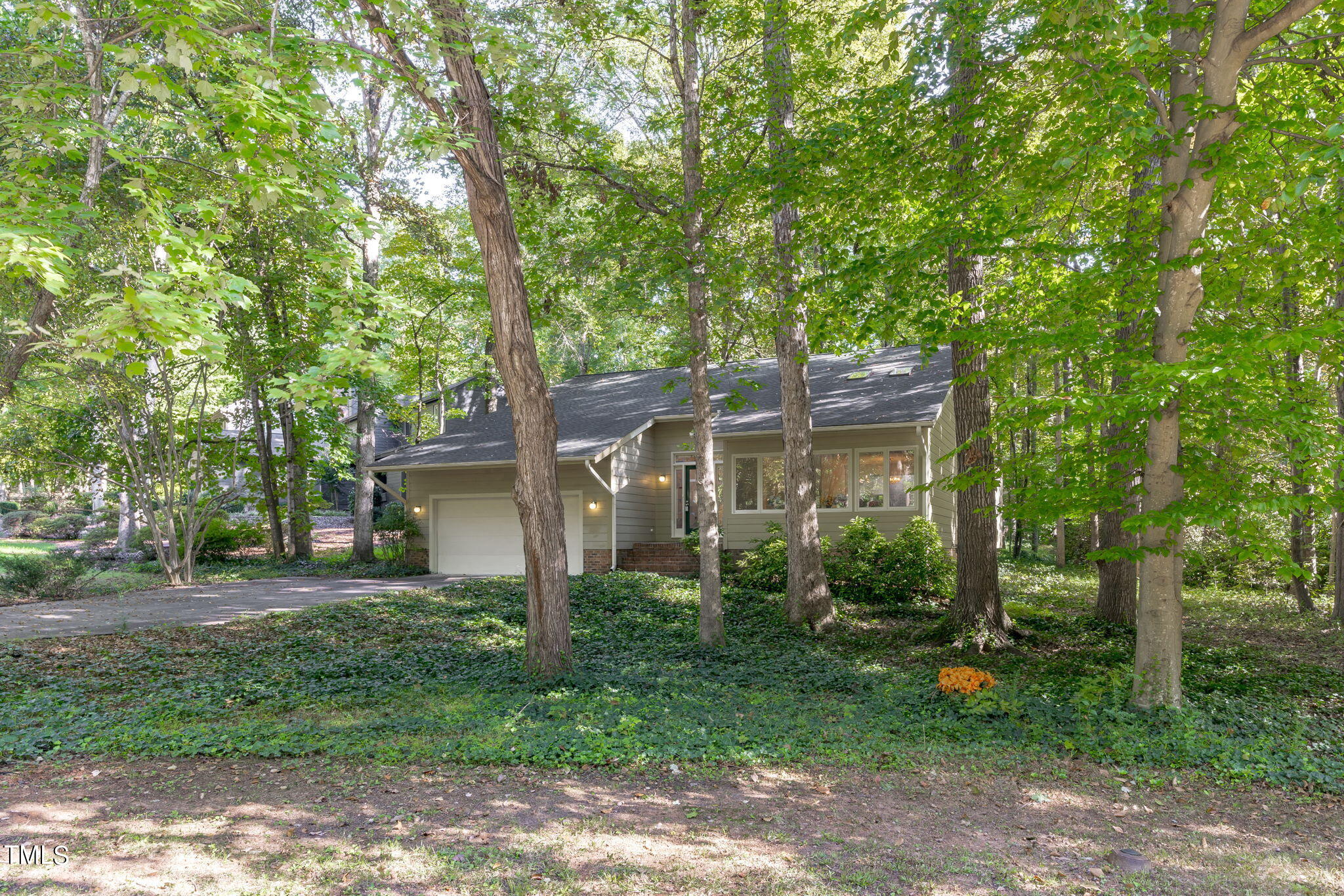 404 King George Loop Cary, NC 27511 - Photo 7 of 60 front view of a house with a tree