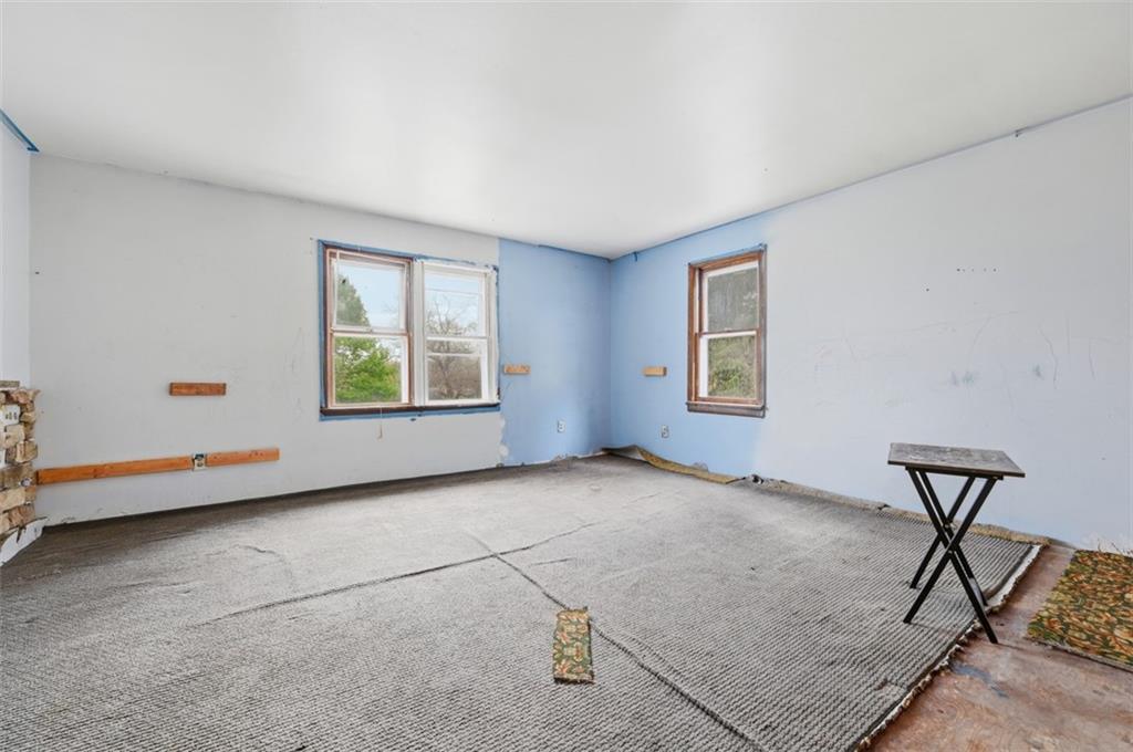 96 Meanor Street Imperial, PA 15126 - Photo 13 of 44 a view of an empty room with window and wooden floor