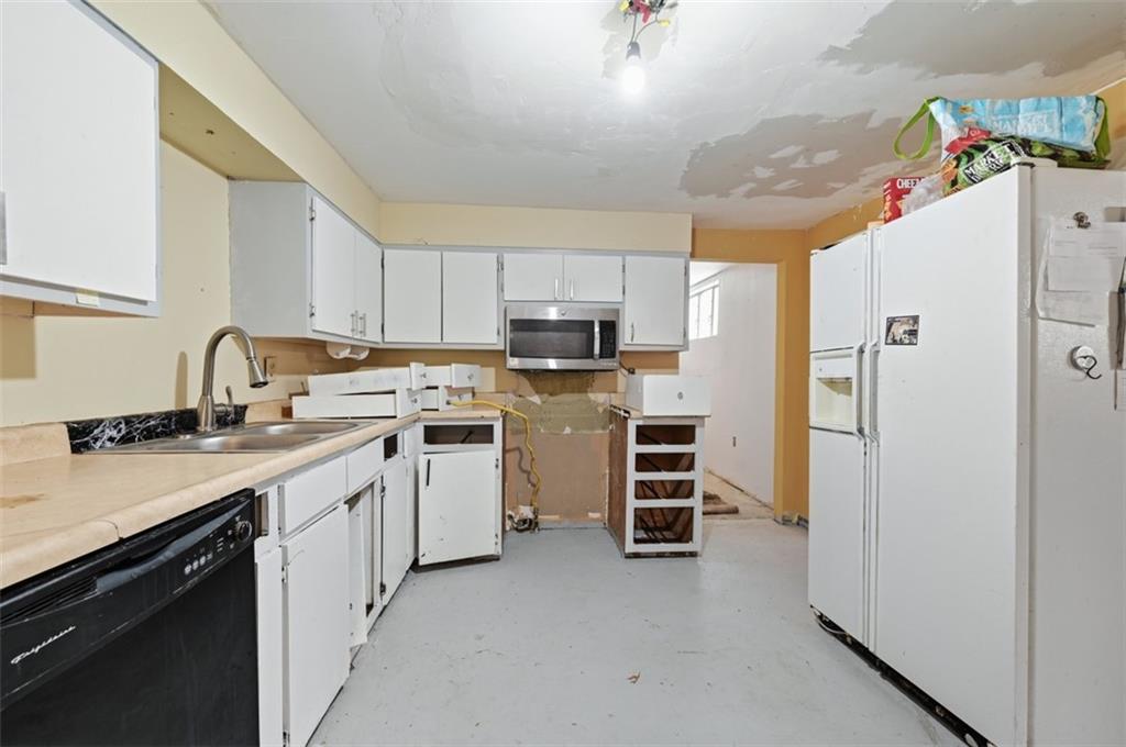 96 Meanor Street Imperial, PA 15126 - Photo 24 of 44 a kitchen with a sink stove and refrigerator