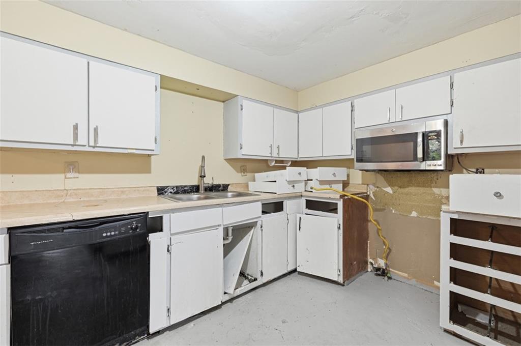 96 Meanor Street Imperial, PA 15126 - Photo 25 of 44 a kitchen with granite countertop white cabinets and stainless steel appliances
