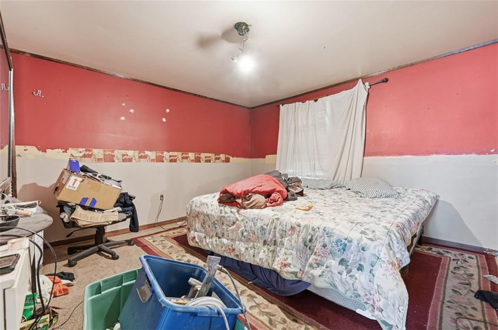 96 Meanor Street Imperial, PA 15126 - Photo 28 of 44 a bedroom with a bed and a chandelier