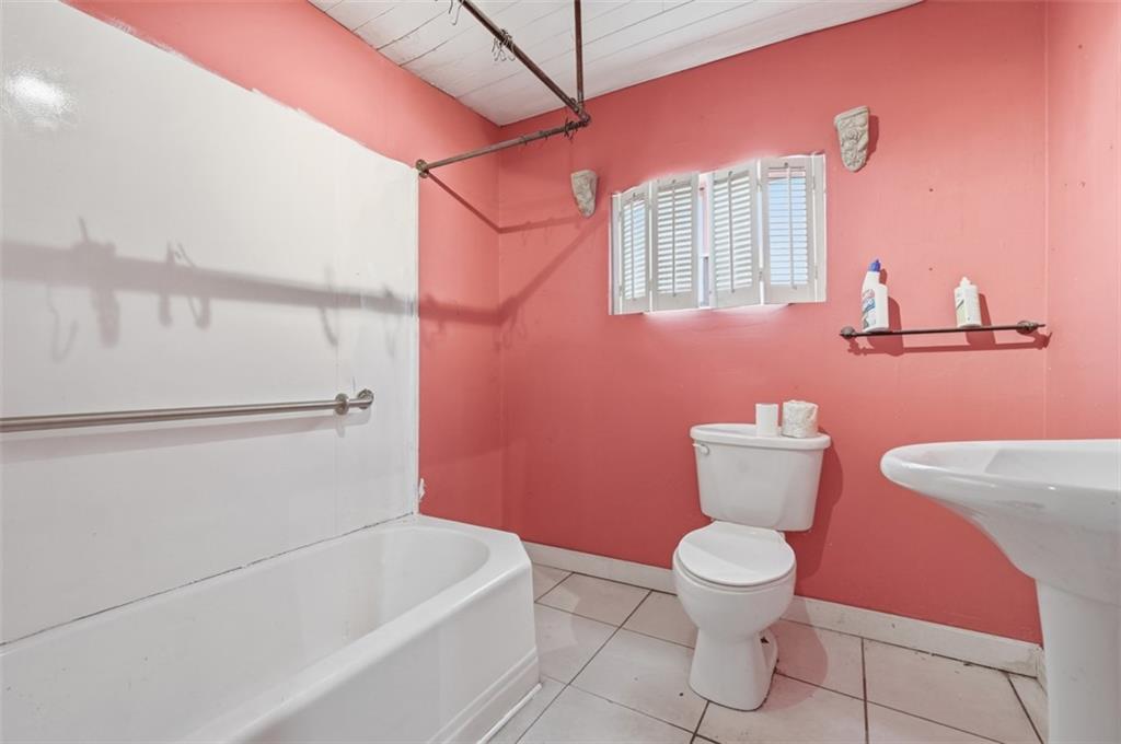 96 Meanor Street Imperial, PA 15126 - Photo 29 of 44 a white toilet sitting next to a bathroom sink