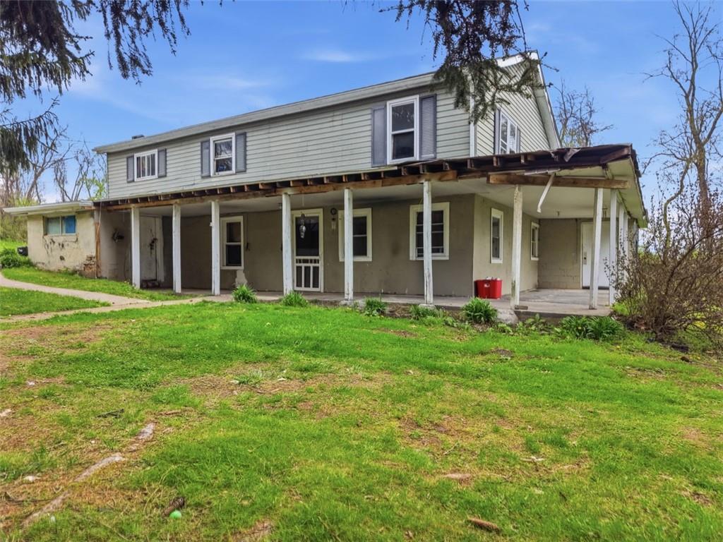 96 Meanor Street Imperial, PA 15126 - Photo 3 of 44 a view of a white house with a big yard and potted plants