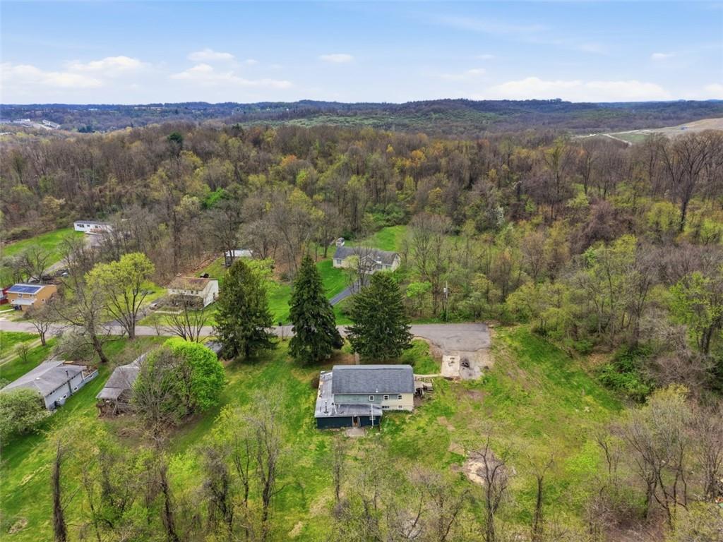 96 Meanor Street Imperial, PA 15126 - Photo 39 of 44 a view of a city with lush green forest