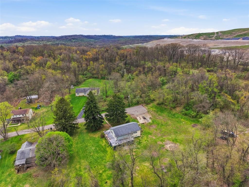 96 Meanor Street Imperial, PA 15126 - Photo 40 of 44 a view of a city with lush green forest