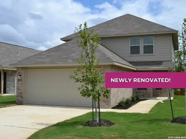 a sign board with a small yard