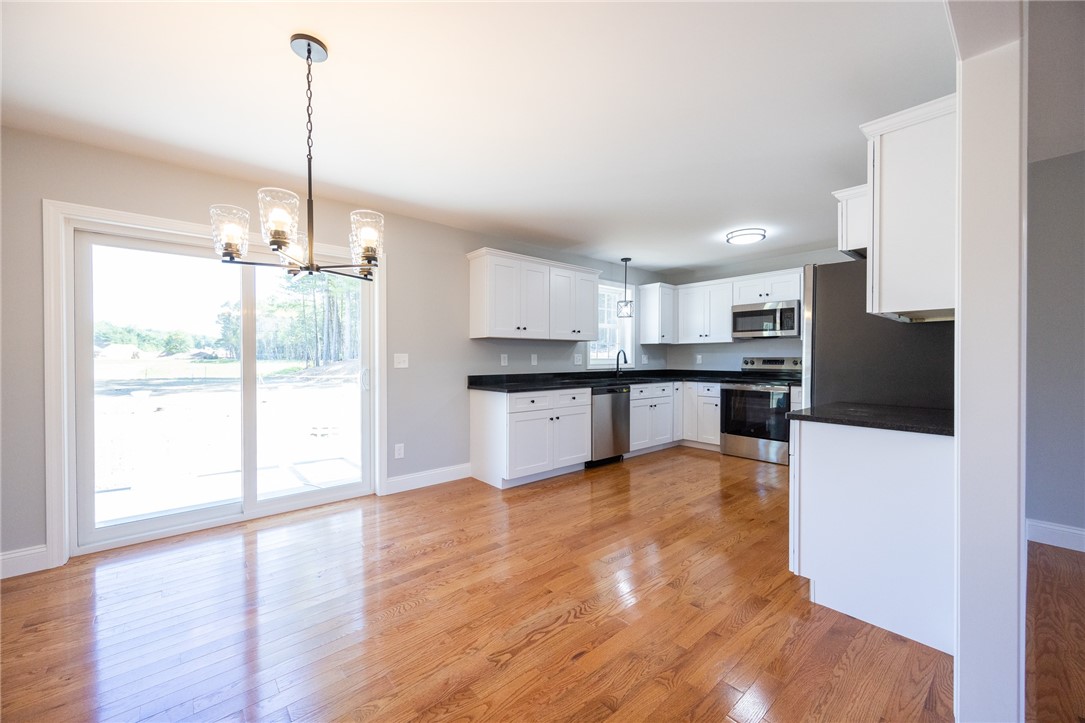 4 Boyd Brook Circle Coventry, RI 02816 - Photo 8 of 32 EAT-IN KITCHEN & SLIDING DOOR TO LARGE BACK DECK