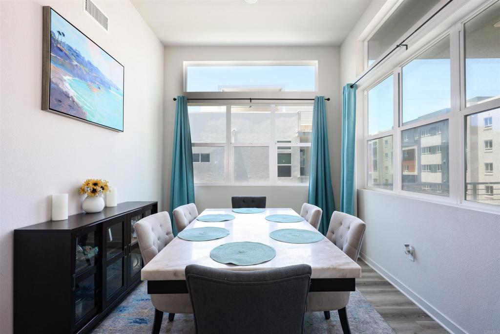 2040 Bravo Loop, Unit 5 Chula Vista, CA 91915 - Photo 29 of 58 a dining room with furniture and window