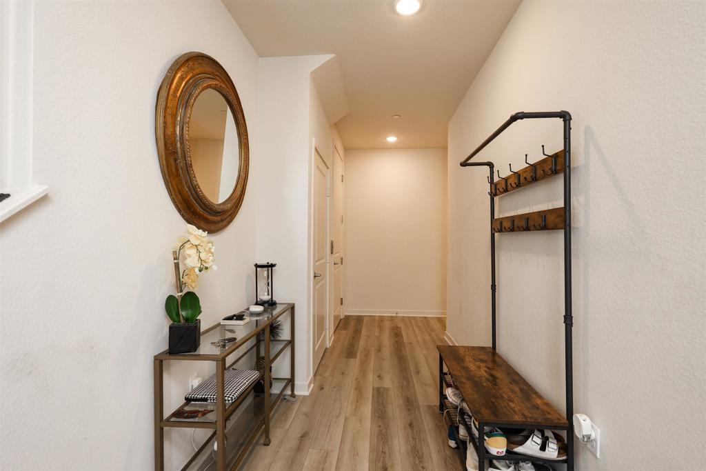 2040 Bravo Loop, Unit 5 Chula Vista, CA 91915 - Photo 43 of 58 a view of a hallway with wooden floor and a bathroom view