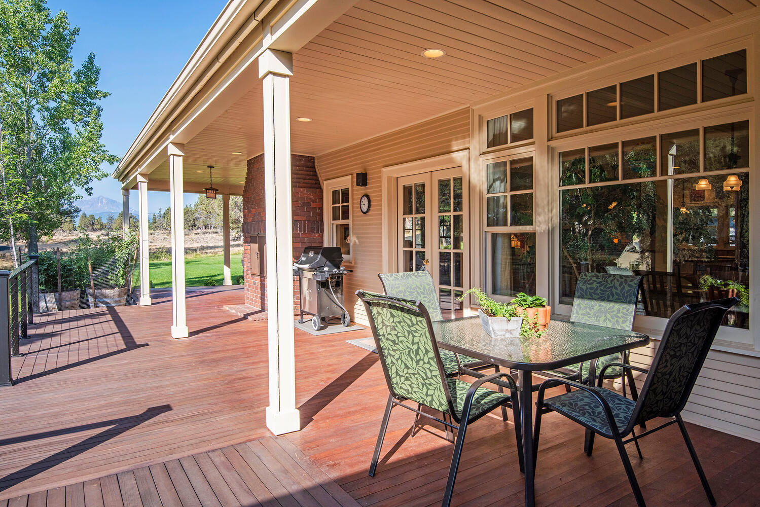 69950 Cowboy Jones Road Sisters, OR 97759 - Photo 46 of 57 Wrap Around Deck and Outdoor Dining Area