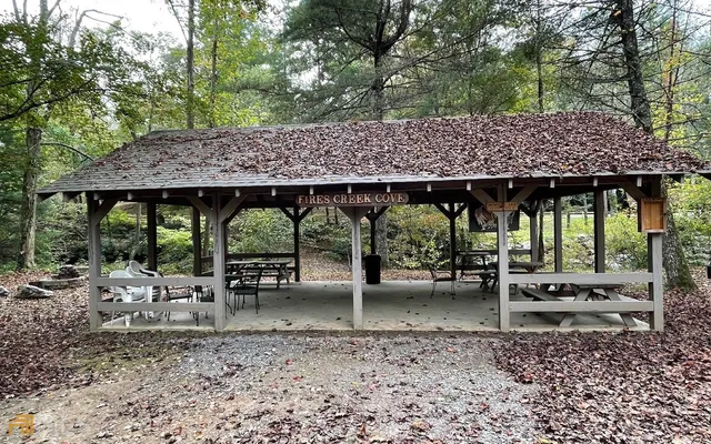 a backyard of a house with barbeque oven