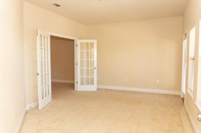 509 Pheasant Trail Crestview, FL 32536 - Photo 18 of 29 an empty room with windows