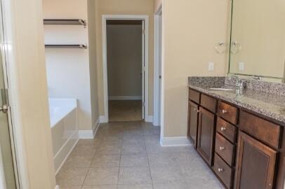 509 Pheasant Trail Crestview, FL 32536 - Photo 23 of 29 a bathroom with a granite countertop sink and a mirror