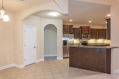 509 Pheasant Trail Crestview, FL 32536 - Photo 7 of 29 a view of kitchen with kitchen island stainless steel appliances sink and stove