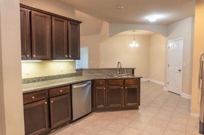 509 Pheasant Trail Crestview, FL 32536 - Photo 10 of 29 a kitchen with a sink and cabinets