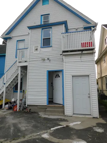 a view of a house with wooden walls