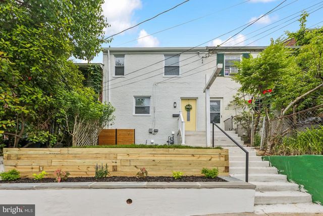 a house with trees in front of it