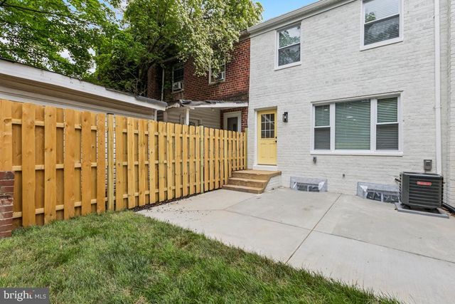 a view of a backyard with sitting area