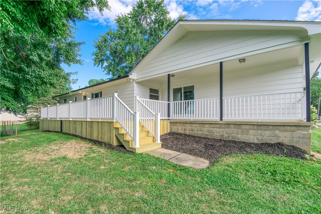 4761 Waterloo Road Atwater, OH 44201 - Photo 34 of 45 Back of house with view of the covered porch, deck and a yard