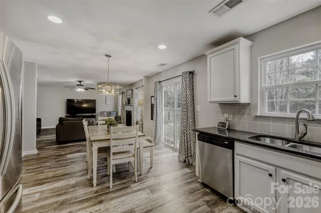 a kitchen with a sink stove and refrigerator