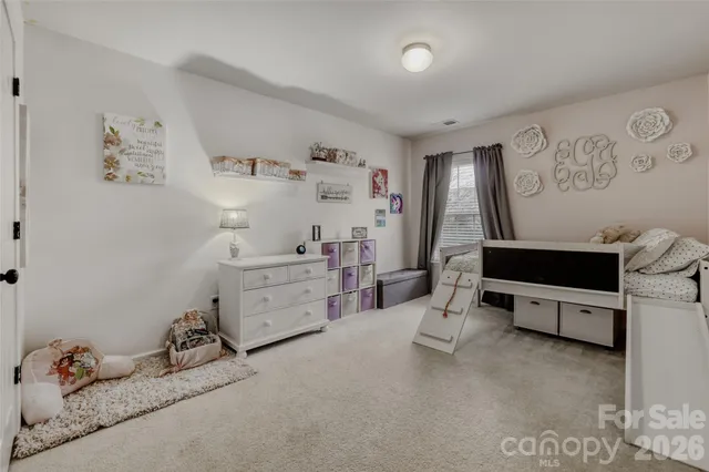 a room with furniture and white walls