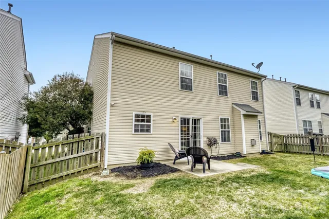 a house view with a outdoor seating