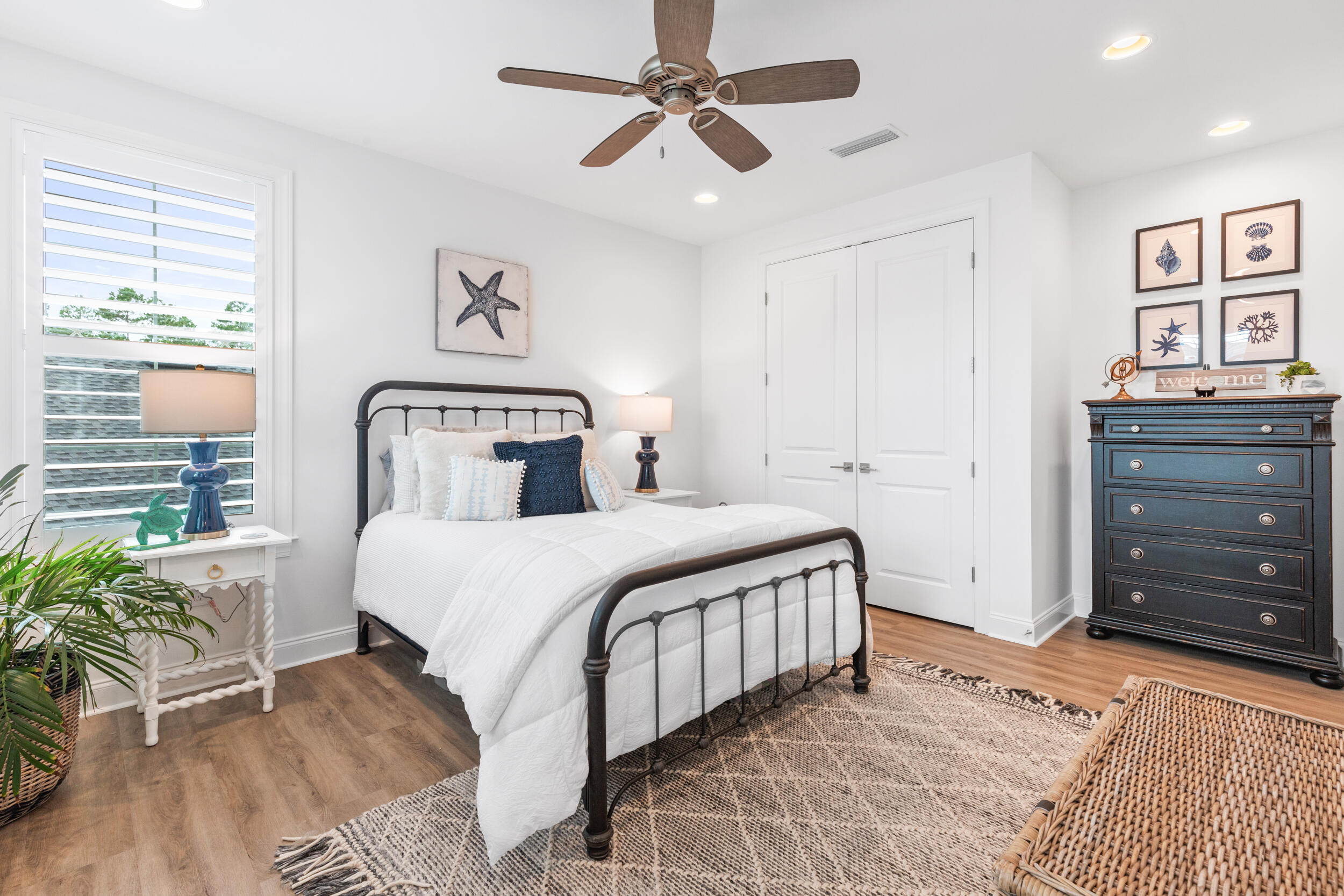 229 Windrow Way Inlet Beach Inlet Beach, FL 32461 - Photo 19 of 43 a bedroom with a large bed and a chandelier