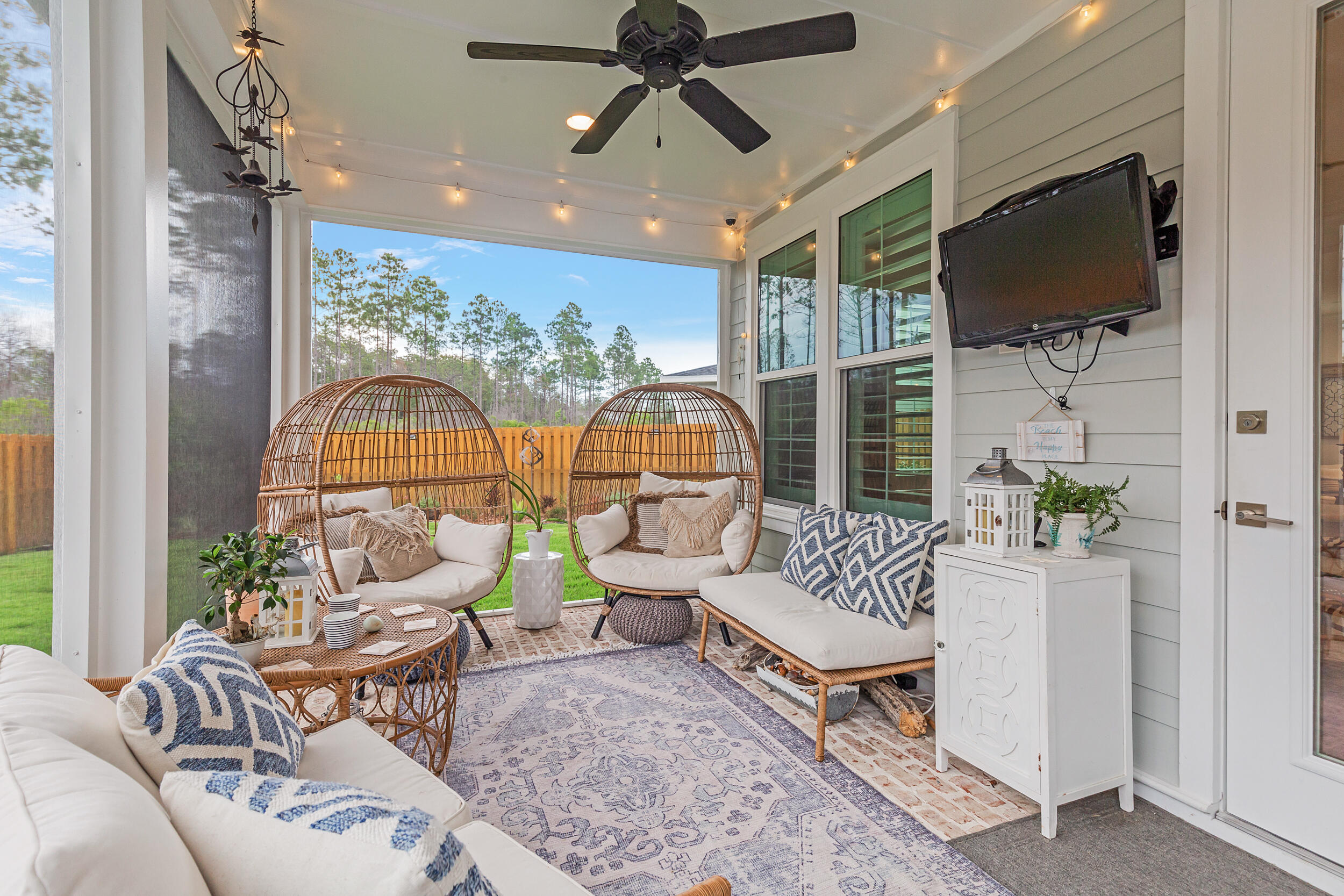 229 Windrow Way Inlet Beach Inlet Beach, FL 32461 - Photo 27 of 43 a living room with furniture a flat screen tv and a large window