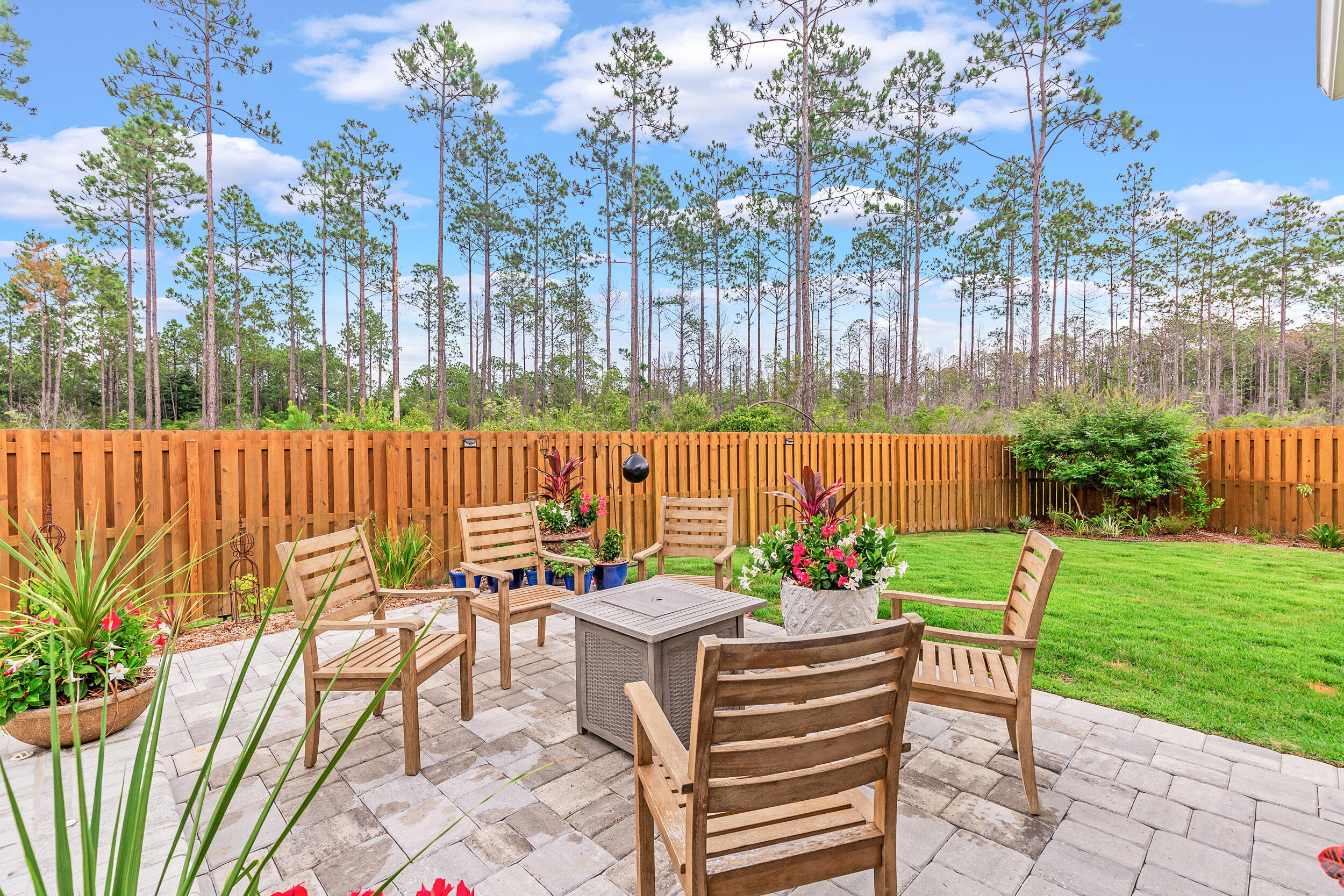 229 Windrow Way Inlet Beach Inlet Beach, FL 32461 - Photo 32 of 43 a view of a chairs and table in backyard of the house