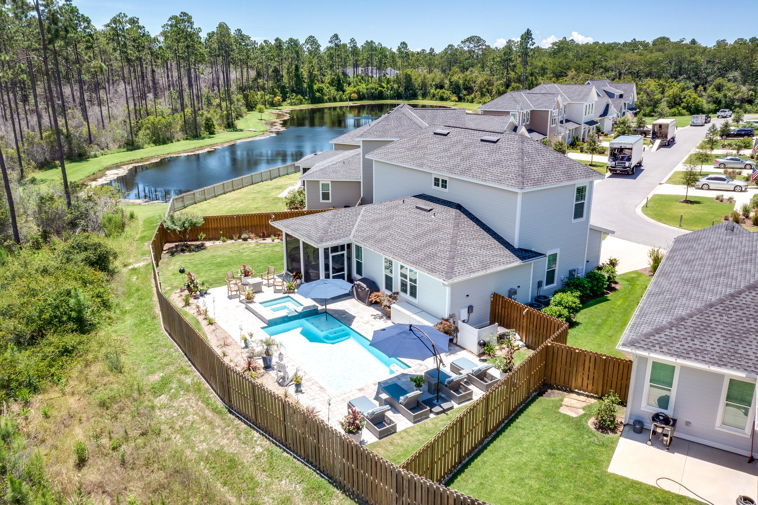 229 Windrow Way Inlet Beach Inlet Beach, FL 32461 - Photo 42 of 43 an aerial view of a house with swimming pool a yard and lake view